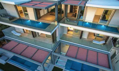 an overhead view of a building with red and blue windows at NV Illusion in Chania Town