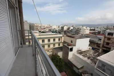 a view of a city from an apartment balcony at Rita's home in Chania Town