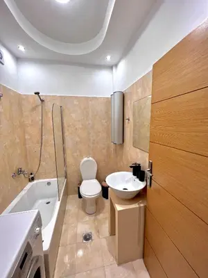 a bathroom with a toilet and a sink and a tub at Casa de Campo 1 in Almirida