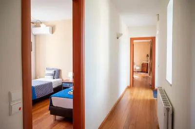 a hallway of a room with a bed and a living room at Orange Tree Garden vacation home in Ayiá