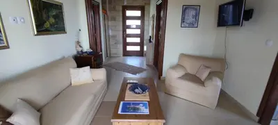 a living room with two couches and a coffee table at Vasiliki's Residence - Breathtaking View in Kissamos