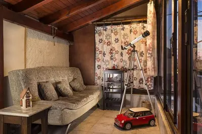 a living room with a couch and a toy car at House Erofili in Chania Town
