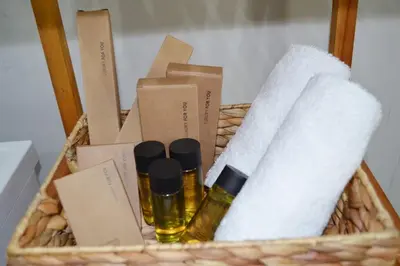a basket with some products and towels in it at MV House Agia Marina in Agia Marina Nea Kydonias