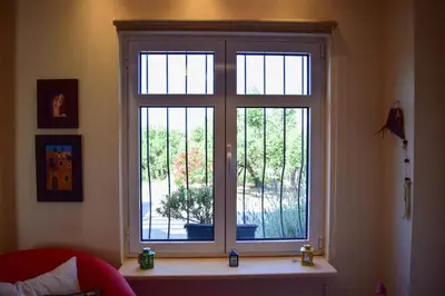 a window in a living room with a plant in a pot at MaGea- Asterias Ground floor peaceful apartment in Tavronitis
