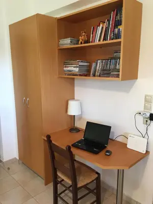 a desk with a laptop computer on top of it at Villa Christina Anidri in Ánidhroi
