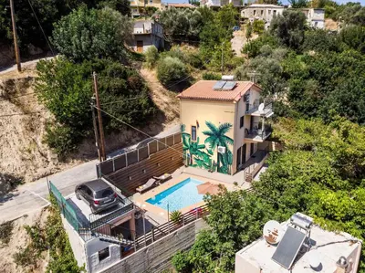 an aerial view of a house with a swimming pool at Villa La Palma in Vrísai