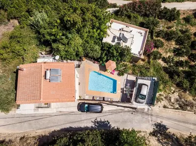 an aerial view of a house with a swimming pool at Villa La Palma in Vrísai