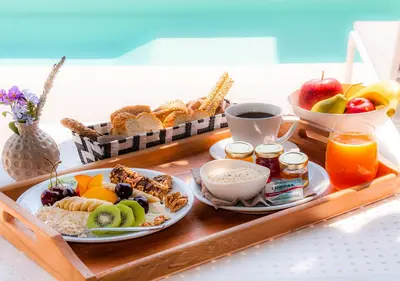 a tray of breakfast food on a table at Epavli Boutique Hotel in Chania Town