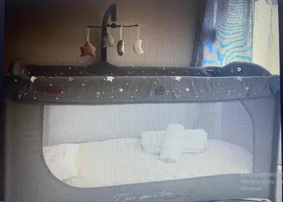 a room with a bed in a shelf with utensils at Evis House in Chania Town