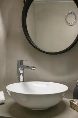 a white sink in a bathroom with a mirror at Penny's Old Town Houses in Chania Town