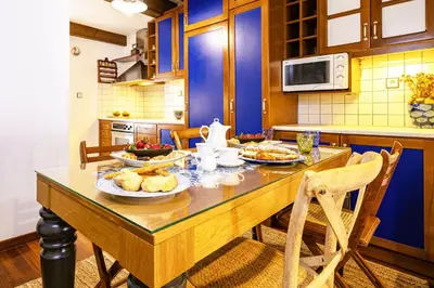 a kitchen with a table with food on it at Chanialiving Venetian Luxury House-near Plaza Parking in Chania Town