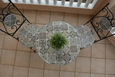 a table with a plant on top of a floor at Villa Aretaki in Kalamaki Chanion