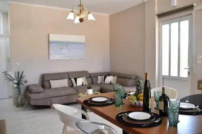 a living room with a table and a couch at House near Balos in Kissamos in Kissamos