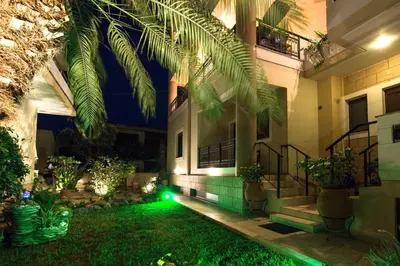 a house with green lights in the yard at Anastellar in Kissamos