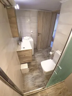 a bathroom with a sink and a toilet at Tonia's Apartment in Kissamos