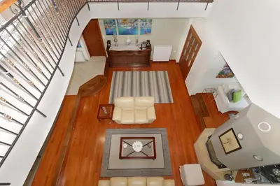an overhead view of a living room with a staircase at Cedar Tree Villa in Kounoupidhianá