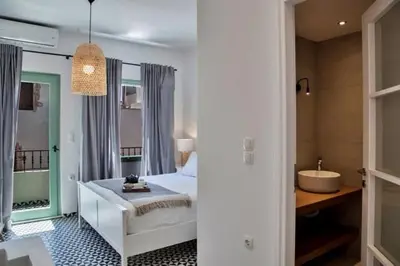 a bathroom with a bed and a tub in a room at Old town, Splantzia modern house in Chania Town