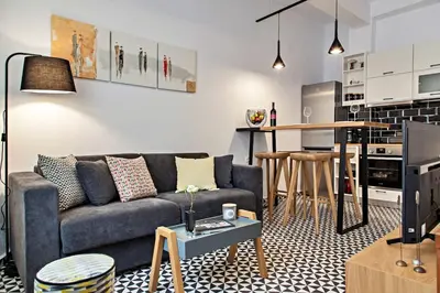 a living room with a couch and a kitchen at Old town, Splantzia modern house in Chania Town