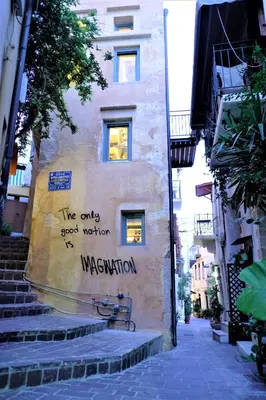 a building with the words the only good written on it at The Journey Design Home Chania in Chania Town