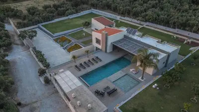 an overhead view of a house with a swimming pool at Villa Aori in Kariá