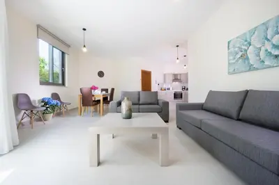 a living room with a couch and a table at Ariadne Apartment in Daratso