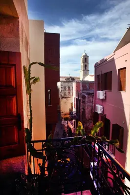 a view of a city from a balcony at Palazzo di Pietro in Chania Town