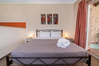 a bedroom with a bed with towels on it at Dream Sea House villa Falassarna in Falasarna