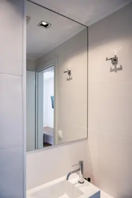 a bathroom with a mirror and a sink at Artemide city places-Cozy Rooms in Chania Town