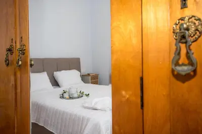 a bedroom with a bed with a plate on it at The Romantic Beach House in Chania Town