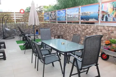 a table and chairs on the patio of a restaurant at Chania City Home in Chania Town