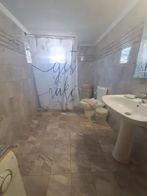 a bathroom with a toilet and a sink at Chania Dream Home in Chania Town