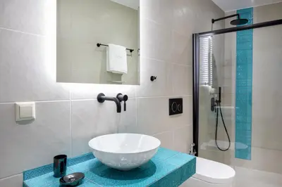 a bathroom with a bowl sink and a shower at Iosifinas Boutique House in Chania Town