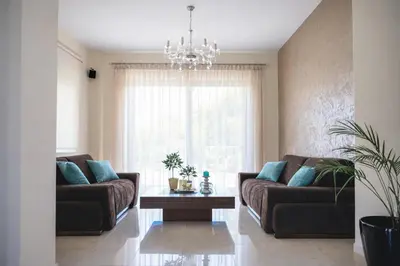 a living room with two couches and a coffee table at Sweven Villa Private Pool & Absolute Privacy , Stunning Sunsets in Souda