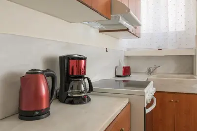 a kitchen with a coffee maker on a counter at Veranda house in Chania Town