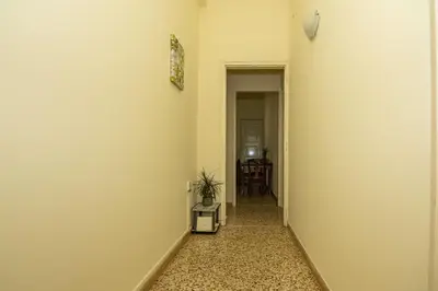 an empty hallway with a plant in a room at Veranda house in Chania Town