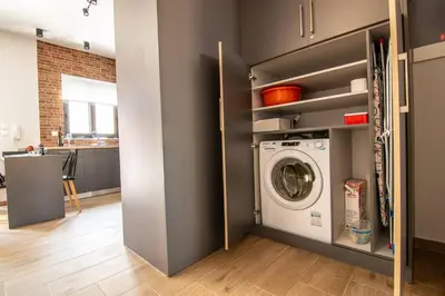 a laundry room with a washer and dryer at MOS Luxury City Suites - The Loft in Chania Town