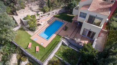 an aerial view of a house with a swimming pool at Malathiros Traditional Villas in Maláthiros