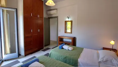a bedroom with a bed and a mirror on the wall at Villa 