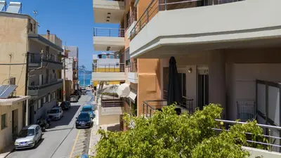 a city street with cars parked on the street at Lazaretta studio in Chania Town