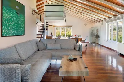 a living room with a couch and a table at Villa Elihrisos in Chorafakia