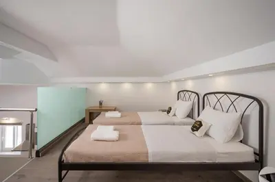 a bedroom with two beds with white pillows at B&M HOUSE,SIRILI,PLATANIAS in Metókhion Sirilíou
