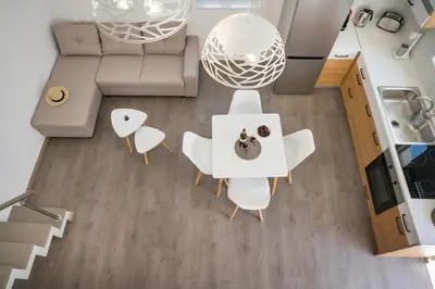an overhead view of a living room with a white table and chairs at B&M HOUSE,SIRILI,PLATANIAS in Metókhion Sirilíou
