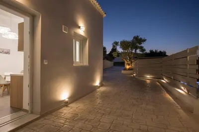 a hallway of a house with lights on the wall at B&M HOUSE,SIRILI,PLATANIAS in Metókhion Sirilíou