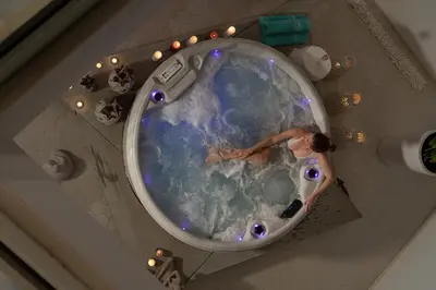 an overhead view of a woman in a bath tub at Lagon Life Spirit Boutique Hotel - Adults Only in Chania Town