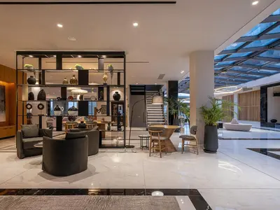a lobby with couches and chairs in a building at Myrion Beach Resort & Spa - Adults Only in Gerani Chanion