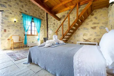 a bedroom with a bed in a room at Villa Talos in Palaiochóra