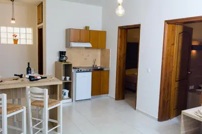 a kitchen with a counter and a stove top oven at Kosmos A.G.K Studios-Apts in Kato Daratso