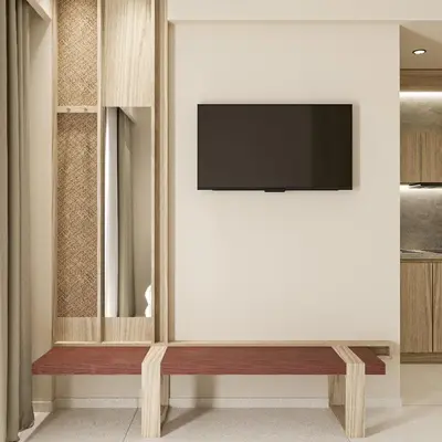 a living room with a television on a wall at Falassarna Beach studios&apartments in Falasarna
