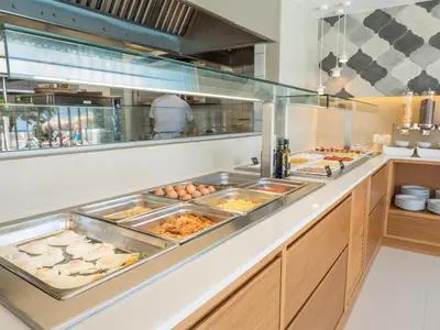 a buffet line with a lot of food at Alexia Beach Hotel in Agia Marina Nea Kydonias