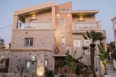 a villa with a view of a building at Miramare Boutique Apartments in Plataniás